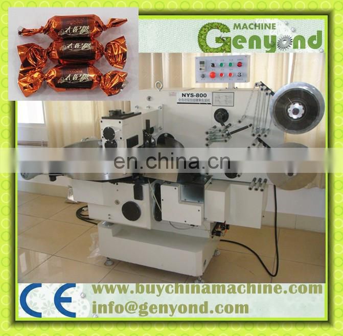 Horizontal double twist candy wrapping machine