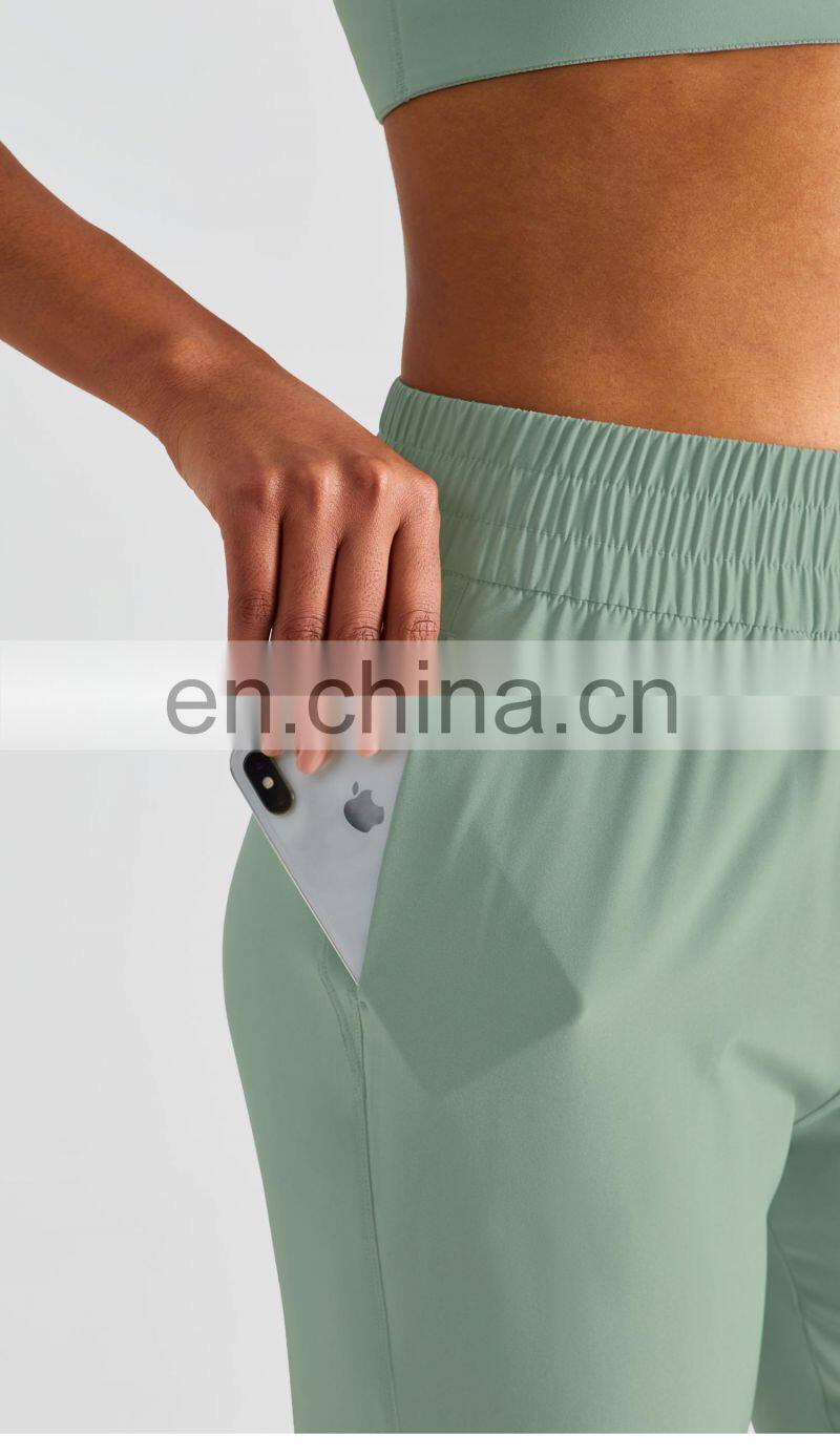 Elastic High Waist Peach Hip Lift Fitness Sweatpants Women Jogging Trouser With Side Pocket