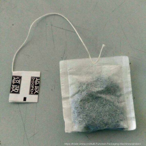 tea bag with tag and thread