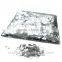 glimmering silver foil confetti for decoration of wedding party