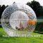 recreation and sport of rolling downhill inside an orb,transparent plastic zorb ball