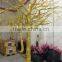 Shopping mall indoor decoration dry tree branches with leaves