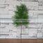 Plastic green cypress branch