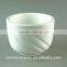 white porcelain cup with embossed wave design