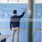 Large size glass magnetic dry erase white board used in meeting room