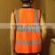 Orange high visibility safety vest with many pockets