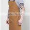 Brown canvas work apron with crossback straps