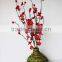 plum artificial flower in vase
