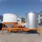 Mobile grain silo-bin dryer with husk as fuel