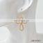 Worn goldworn silver knot earring