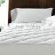 white quilt bed cover