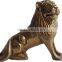 brass lion sitting sculpture