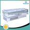 Supermarket reaching deli display refrigerated meat case