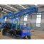 Portable hydraulic trailer mounted portable water well drilling rig