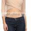 Solid color V-neck 3/4 length sleeve surplice cropped top.