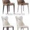 Concaved headrest dinning chair with white glossy PU covering and iron legs