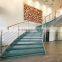 painted steel stringer laminated glass treads curved stairwith stainless steel rod railings