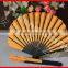 Chinese folding hand fan with black bamboo ribs