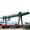 Boxed beam double girder gantry crane portal with saddles and cantilevers