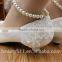 The pearl chain is low with white bridesmaid shoes and the wholesale bridal shoes are taken by the wholesale bride dress WS027