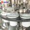 Automatic filling and sealing machine for water emulsion plastic tubes such as toothpaste and hand cream