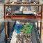 Self-cleaning permanent magnetic separator for conveyor belts