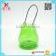 candle glass jar sprayed with green with metal handle