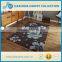 Brown/blue hand carved acrylic a bold floral pattern and stems in natural brown rug for living room