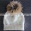 flat knit cashmere beanie hat with raccoon fur pompoms