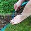 Garden grass borders flat soaker hose irrigation