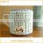 Ceramic coffee mug with knitted sleeve cover