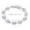 Lucky jewelry white synthetic cubic zirconia charm bracelet in white gold plated