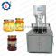 Small automatic induction sealing lids machine for bottle and jar vacuum capping machine