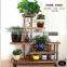 China factory wholesale antique wooden plant stand with wheels