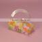 Clear PVC plastic box with a large half circle handle