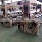 Weaving machine water jet loom with tucking device