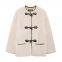 Belted fur-effect coat with pocket design for fall and winter, featuring a loose and warm fit. The coat is decorated with knotted embellishments.