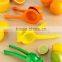 Plastic manual citrus fruit juicer tongs