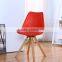 Molded plastic chair with beech wood legs