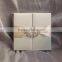 New arrival hot sale luxurious cream-colored silk hardcover wedding invitations ribbons&rhinestone brooches