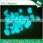 Blue green glowing glass chips for garden decoration