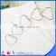 Heart made metal clips shiny gold wire