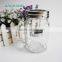 Decorated candle in clear glass jar