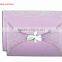 Luxurious & shining purple pocket fold wedding invitations with silver flourish art design & bow