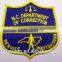 Embroidery emblem with adhesive for worker uniform