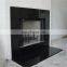 carved black granite fireplace surround,stone fireplace