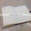 Notebook with button for closure