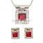 large red crystal surrounded by clear microset crystals necklace and earring