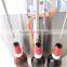 Small Semi automatic Bottom up digital liquid milk Beer bottle filling machine
