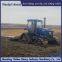 2004 Tractor modification with triangular track wheels for anti-skid on muddy ground